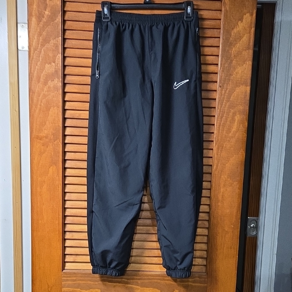 Kids Nike Black Track Pants with White Swoosh Accent
